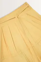 Lange rok met ceintuur en plooidetail