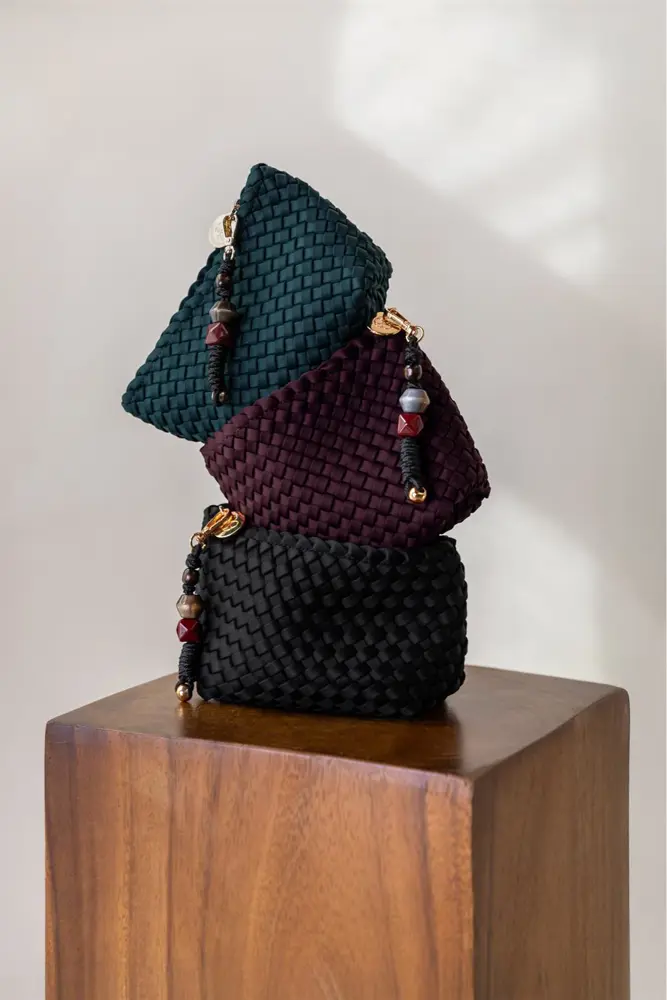Gevlochten pouch met charm