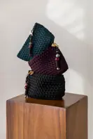 Gevlochten pouch met charm