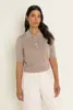 Gebreide polo met metallic garen