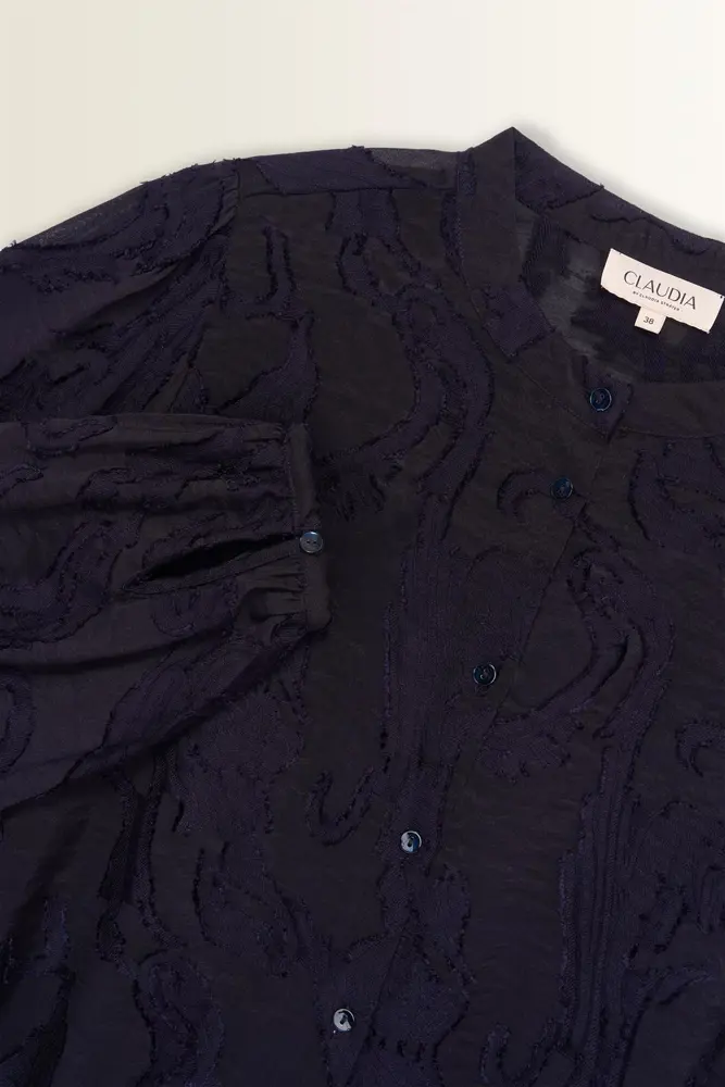 Transparante blouse met borduurstructuur